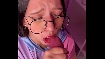 Sweet and nerdy girl with glasses gives a satisfying blowjob after class